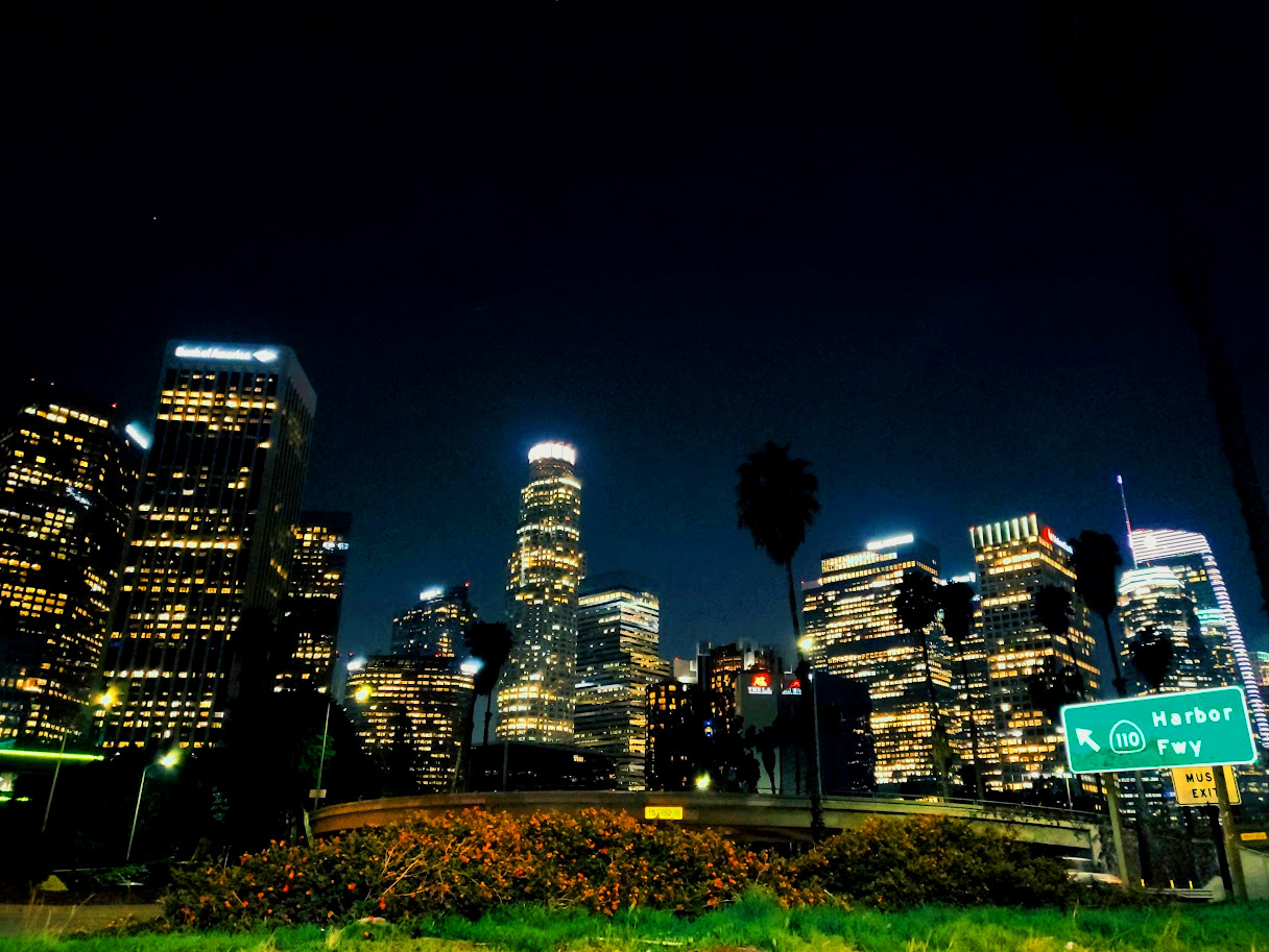 Downtown Los Angeles illuminated skyline with night lights and skyscrapers
